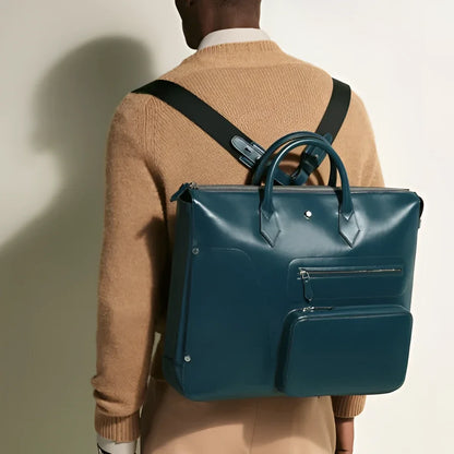 Montblanc borsa 24/7 soft blu legion in pelle teal con design strutturato e spallacci neri maestria artigianale