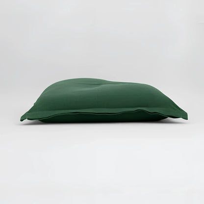 Maxi cuscino firenze verde scuro con superficie morbida leggermente arricciata dimensioni generose infinito abbraccio