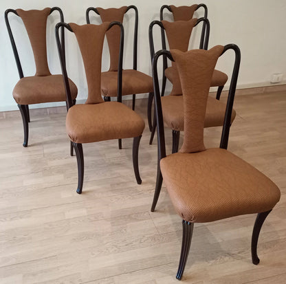 Set di quattro sedie pranzo vintage con tappezzeria color cuoio gambe nere curve design anni 50 restaurate